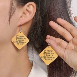 Statement earrings • If you’re looking for a sign to drink tonight, this is it